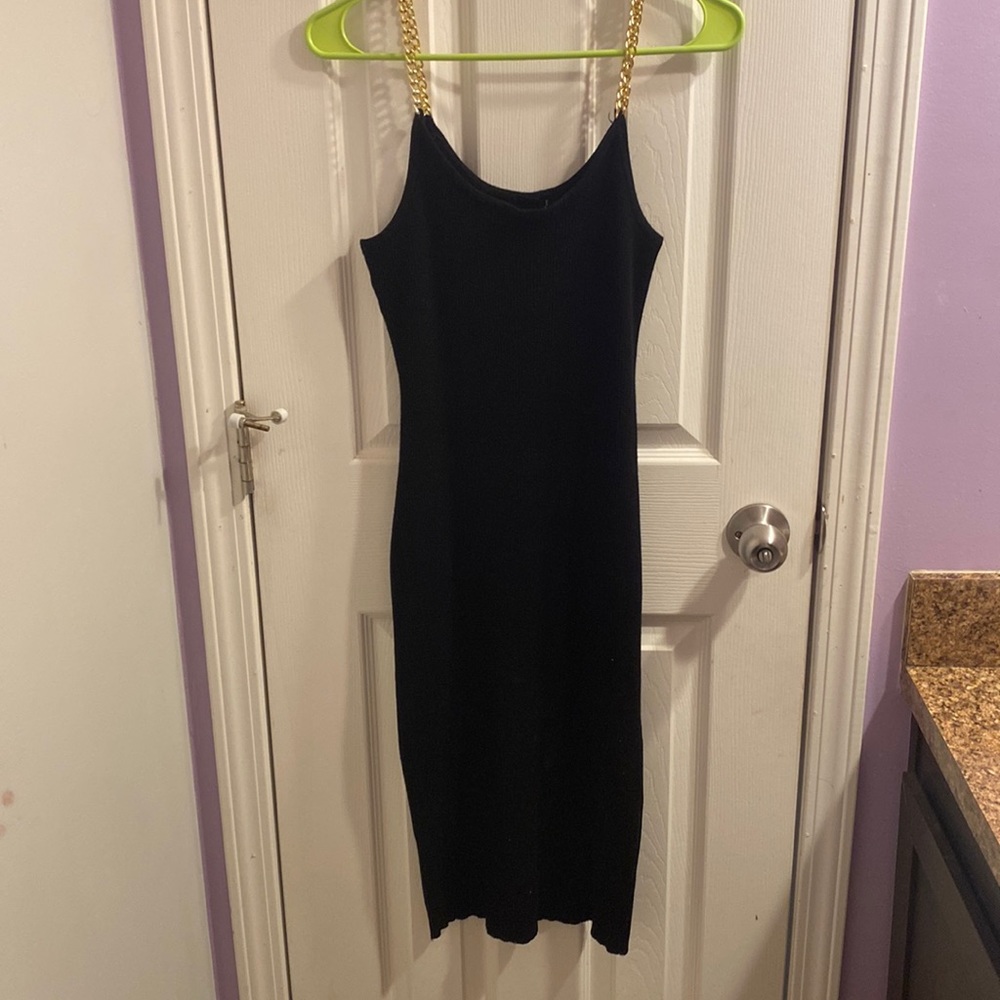 Black maxi dress with gold chain straps. Stretchy and ribbed mineral